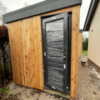 Cedar clad home office and storage shed