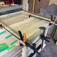 Glueing, pinning and clamping the frame and cladding